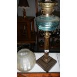 A Victorian oil lamp with Paladian column,