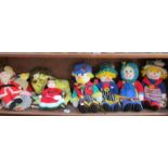 A shelf of hand knitted toys