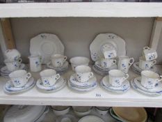 A shelf of Victoria china tea ware