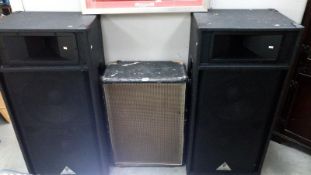 A pair of professional Behringer speakers with top horns and a speaker cabinet