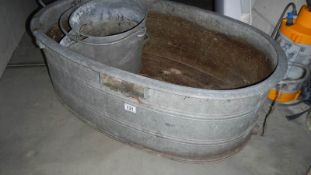 A large metal trough and other items