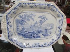 A blue and white willow pattern meat platter