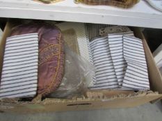 A box of vintage fabric items