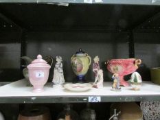 A shelf of miscellaneous figures,