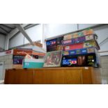 A quantity of jigsaw puzzles etc