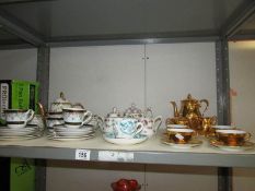 A shelf of assorted tea ware