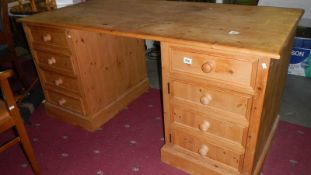 A large pine double pedestal desk