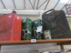 A quantity of petrol and oil cans
