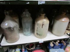 A shelf of stoneware jars etc