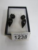 A pair of carved Whitby jet pendant earrings