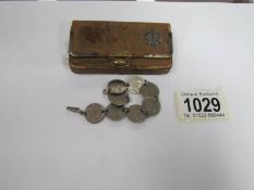 A coin bracelet and a silver edged purse