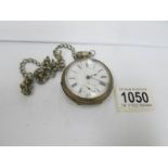 An old pocket watch on chain,