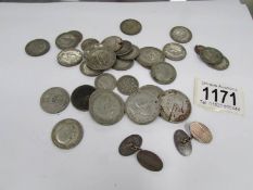 Approximately 200 grams of pre 1947 silver coins and a pair of silver cuff links