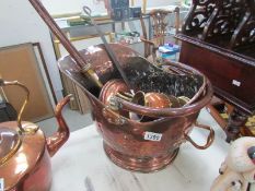 A copper coal scuttle, warming pan, chestnut roaster,