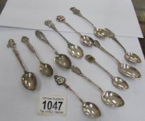 11 sterling and 800 silver souvenir spoons,