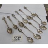 11 sterling and 800 silver souvenir spoons,