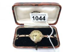 A ladies 9ct gold wrist watch on 9ct gold strap