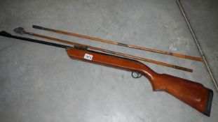 A BSA air rifle with 2 rods