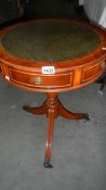 A tripod drum table