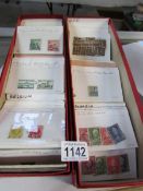 2 boxes of stamps in packets including Belgium, Finland,