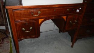 A mahogany inlaid desk