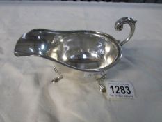 A silver gravy boat,