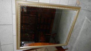 A gilt framed mirror