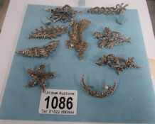 A collection of 9 marcasite brooches