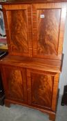 A mahogany 4 door cupboard