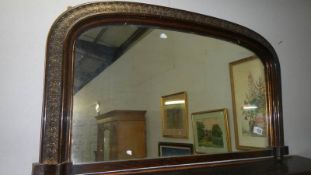 An over mantel mirror