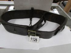 An old leather belt with attached pockets