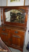 A mahogany mirror backed sideboard