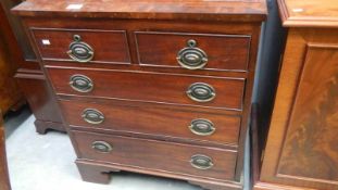 A 2 over 3 mahogany chest of drawers