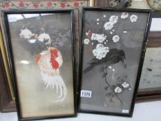 A pair of framed and glazed oriental bird pictures