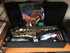 An SMS Academy alto saxaphone in case