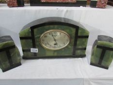 A French green and black marble clock garniture,