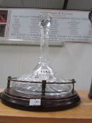 A captain's ship decanter on galleried stand