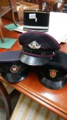 3 European fire service caps and a Queensland fire service cap