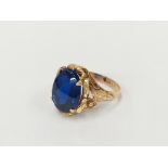 An 18 carat gold blue stone ring,