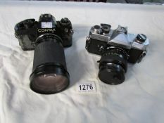 A Fijica ST705W camera with Fujinon 55 mm lens and a Contax 139 camera with Tamaron 35-135mm lens