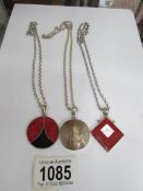 3 silver pendants on chains