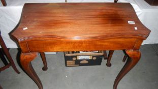A mahogany fold over table