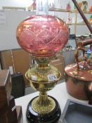 A Victorian oil lamp with later shade