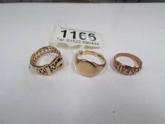 A 9ct gold MIZPAH ring size L, a 9ct gold signet ring size Q and a 9ct gold buckle ring size L,