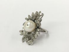 A large 14 carat white gold diamond and pearl ring,