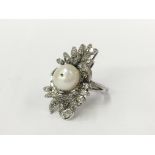 A large 14 carat white gold diamond and pearl ring,