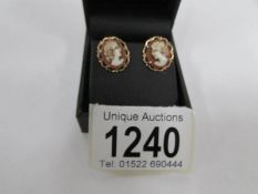 A pair of cameo ear studs in 9ct gold with female profiles