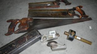 A quantity of old woodworking tools including 2 tenon saws and 2 shaping planes