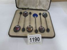 A cased set of 6 silver and enamel coffee spoons