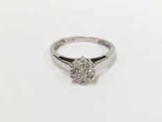 A quarter carat 7 stone diamond 18 carat white gold ring,